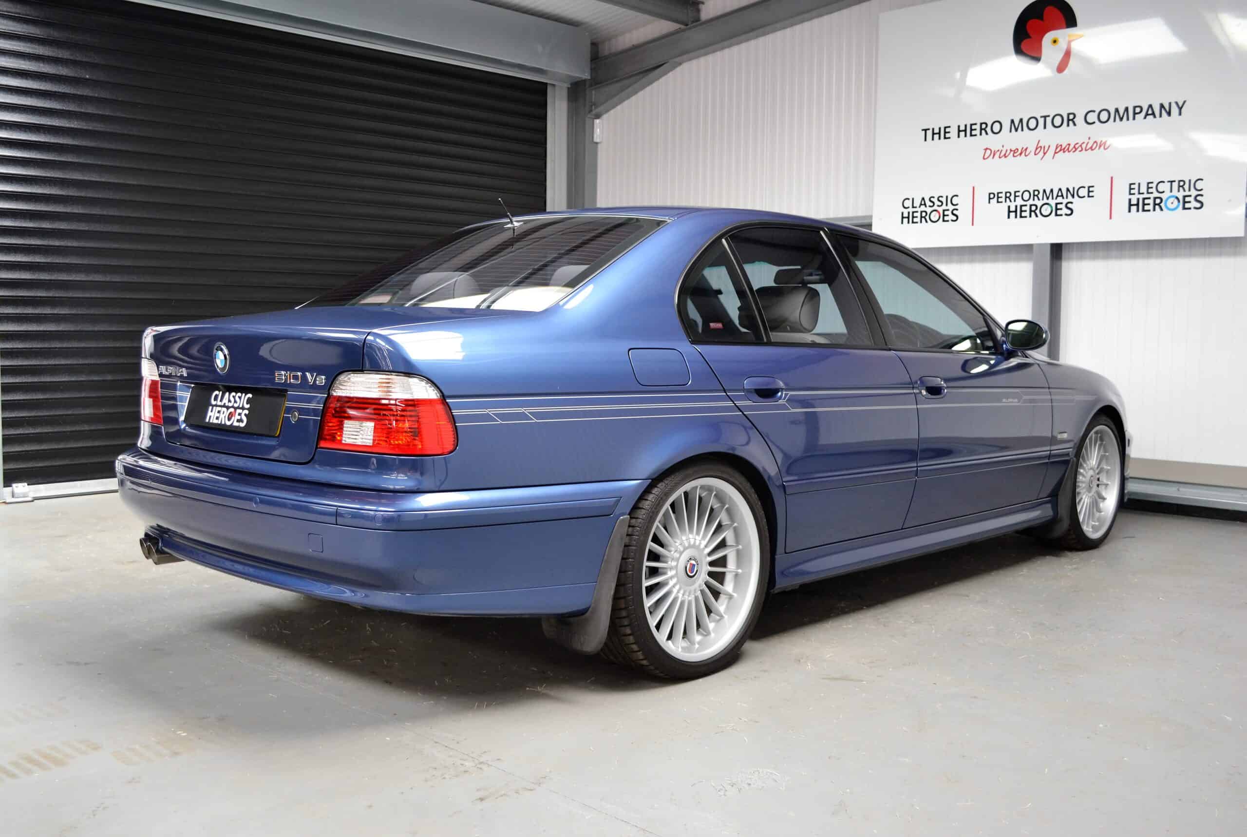 Rear offside view of exterior Alpina B10 V8 with high gloss trim and alloy wheels.