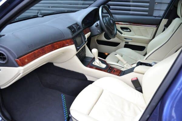 Alpina B10 Nearside Interior creme leather automatic gearbox and black steering wheel.