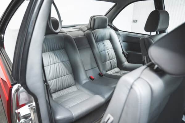 Silver leather back seats of E24 M635 Highline CSL in Zinnober Red.