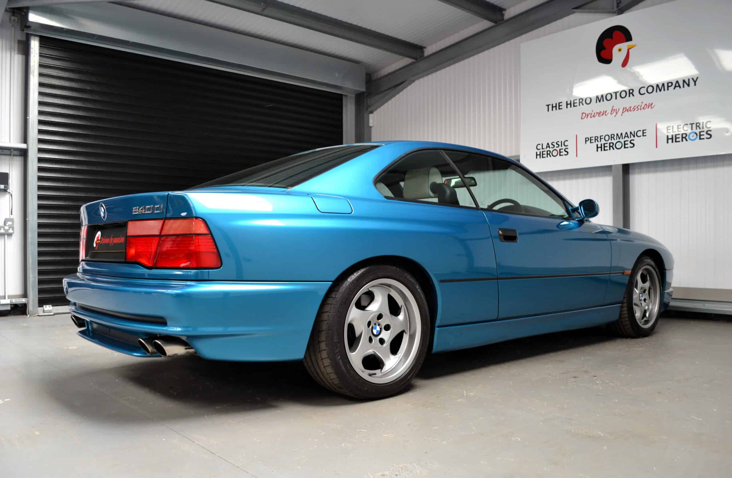 Atlantis Blue BMW E31 840ci drivers side rear quarter.