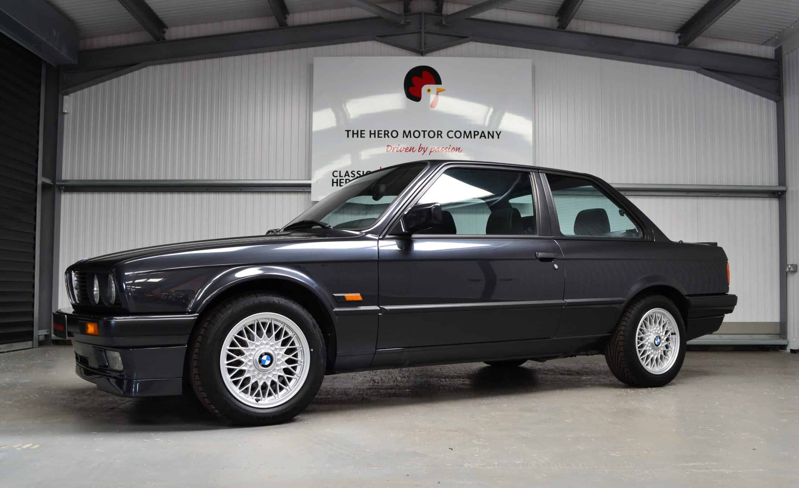 Nearside front quarter left hand drive Diamond Black E30 320is 3 door with alloy wheels.