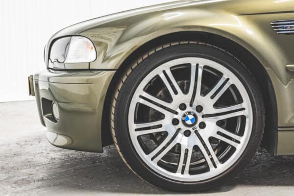 Nearside view of BMW E46 M3 in Messing metallic showing 19 inch wheels and a BMW badge.