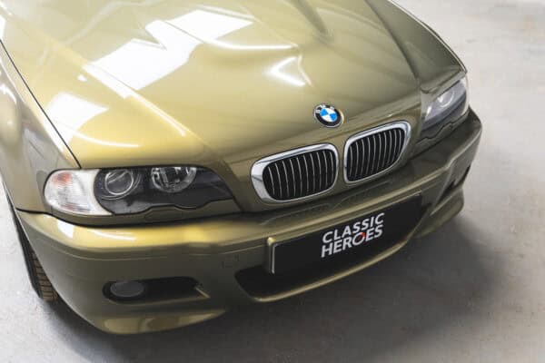 BMW E46 M3 nearside front bonnet showing xenon headlamps and BMW badge.