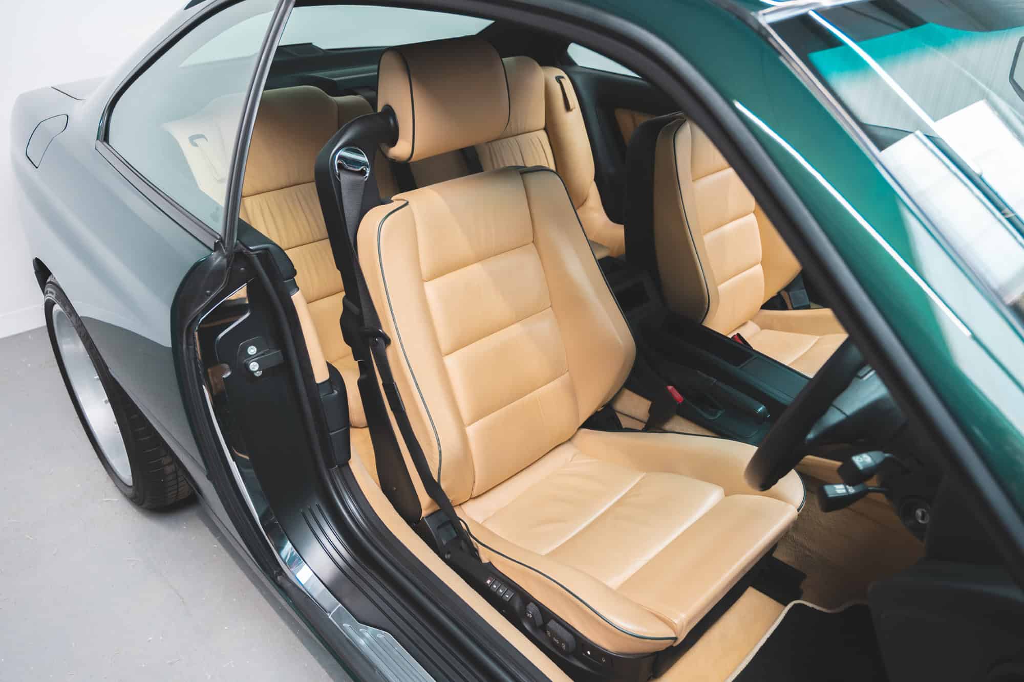 Front drivers seat in Sand Beige Leather of a BMW E31 840 Ci sport coupe.