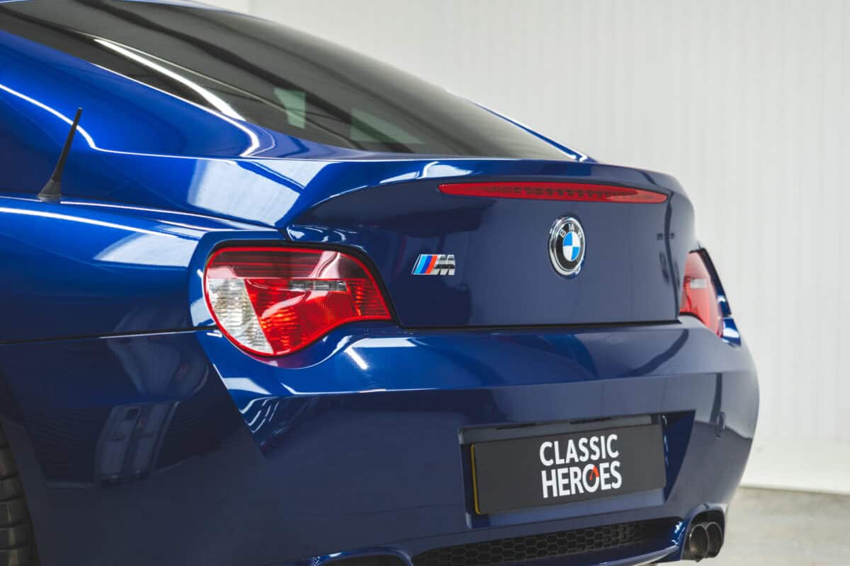 Nearside rear exterior of BMW E86 Z4 M Coupe showing tail lights and M badge.