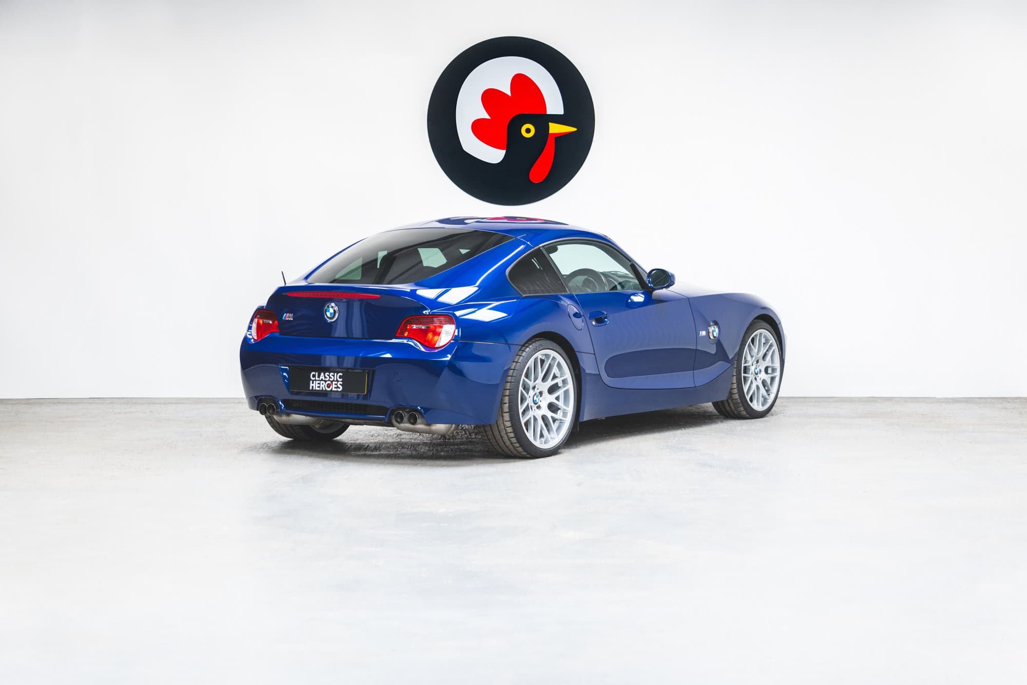 Rear offside exterior of BMW E86 Z4 M Coupe showing tailpipes and alloy wheels.