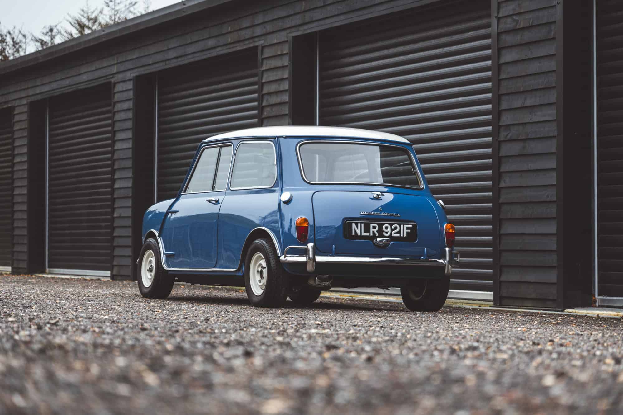 Rear nearside exterior of Mini Cooper S in blue with chrome bumper.