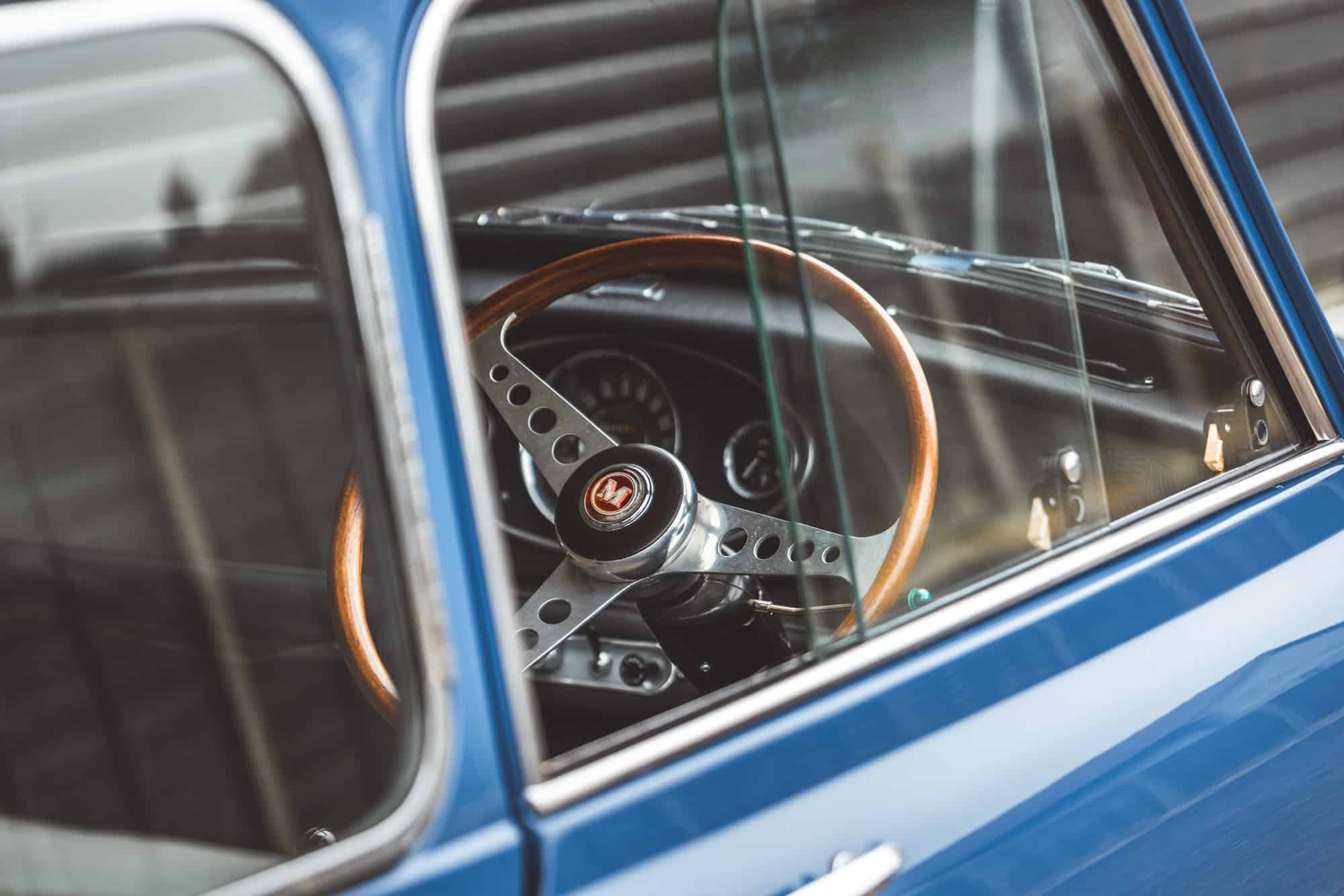 Close up of steering wheel through window of Morris Mini Cooper S.