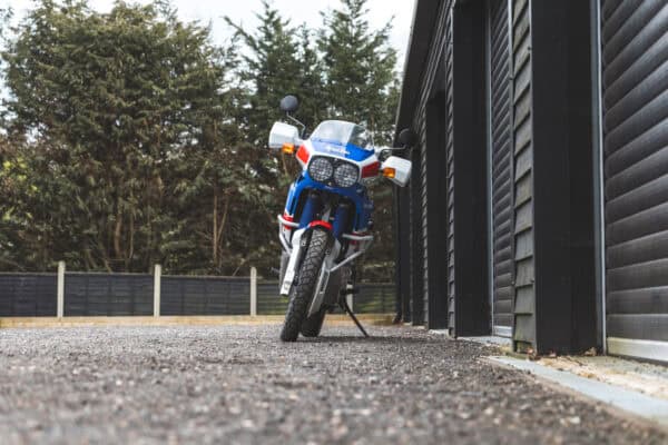 Front view of Honda Africa Twin leaning on kick stand.