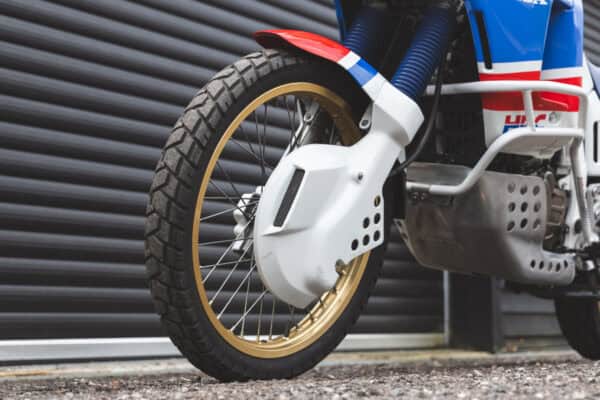 Front wheel and suspension arms on Honda Africa Twin.