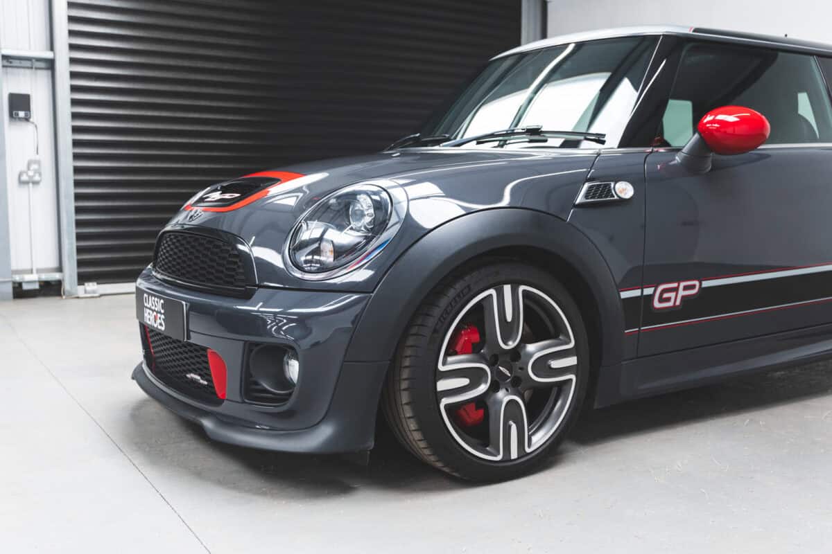 Front nearside quarter of Bonnet and decals of Thunder Grey Mini Cooper S R56 John Cooper Works GP2 with 7.5 x 17-inch light-alloy wheels.