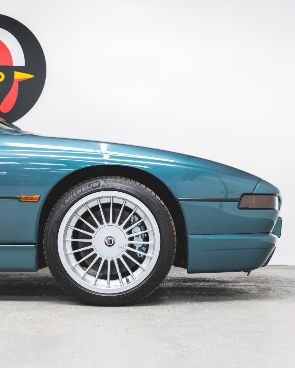 Front quarter and 18 inch alloy wheels on BMW E31 850 CSI Barbados Green.