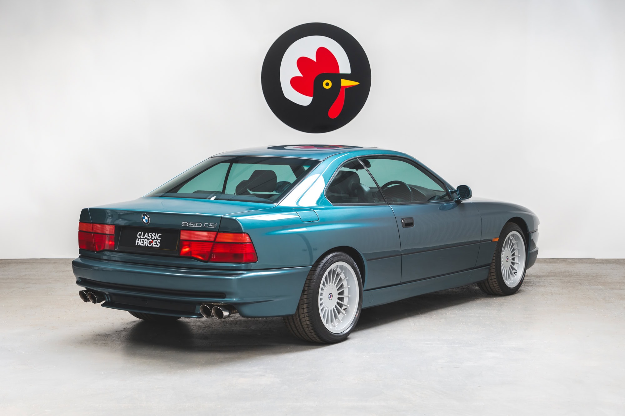 Rear offside exterior view of BMW E31 850 CSI Barbados Green showing 18 inch alloy wheels.