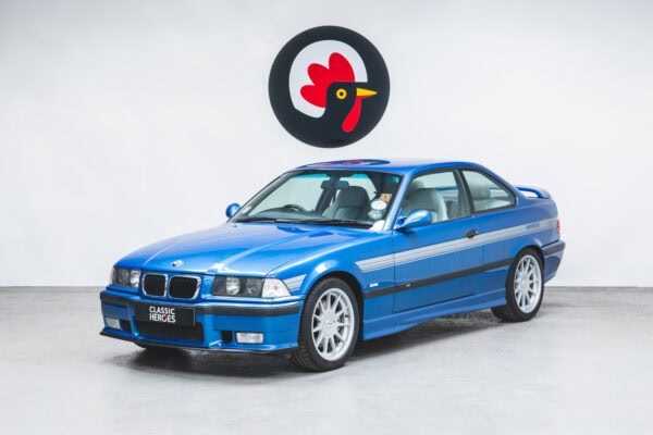 Nearside front exterior showing alloys on BMW E36 M3 Hartge Estoril Blue Coupe.