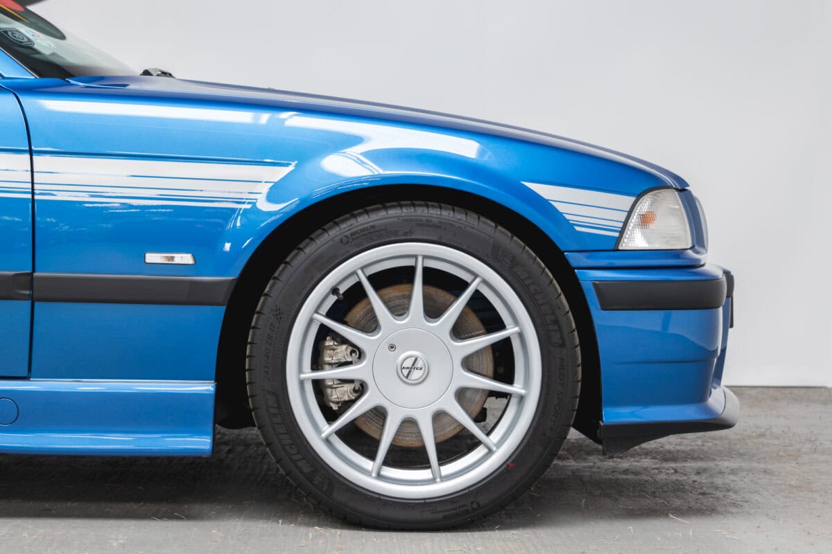 Front quarter panel and alloy wheels on BMW E36 M3 Hartge Estoril Blue Coupe.