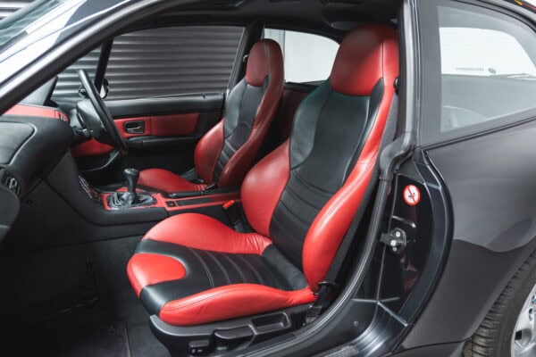 Nearside interior in black and red leather on BMW E36 Z3 M Coupe Sapphire Black.