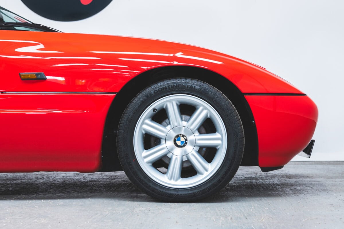 Offside exterior front quarter showing alloys on Top Red Z1.