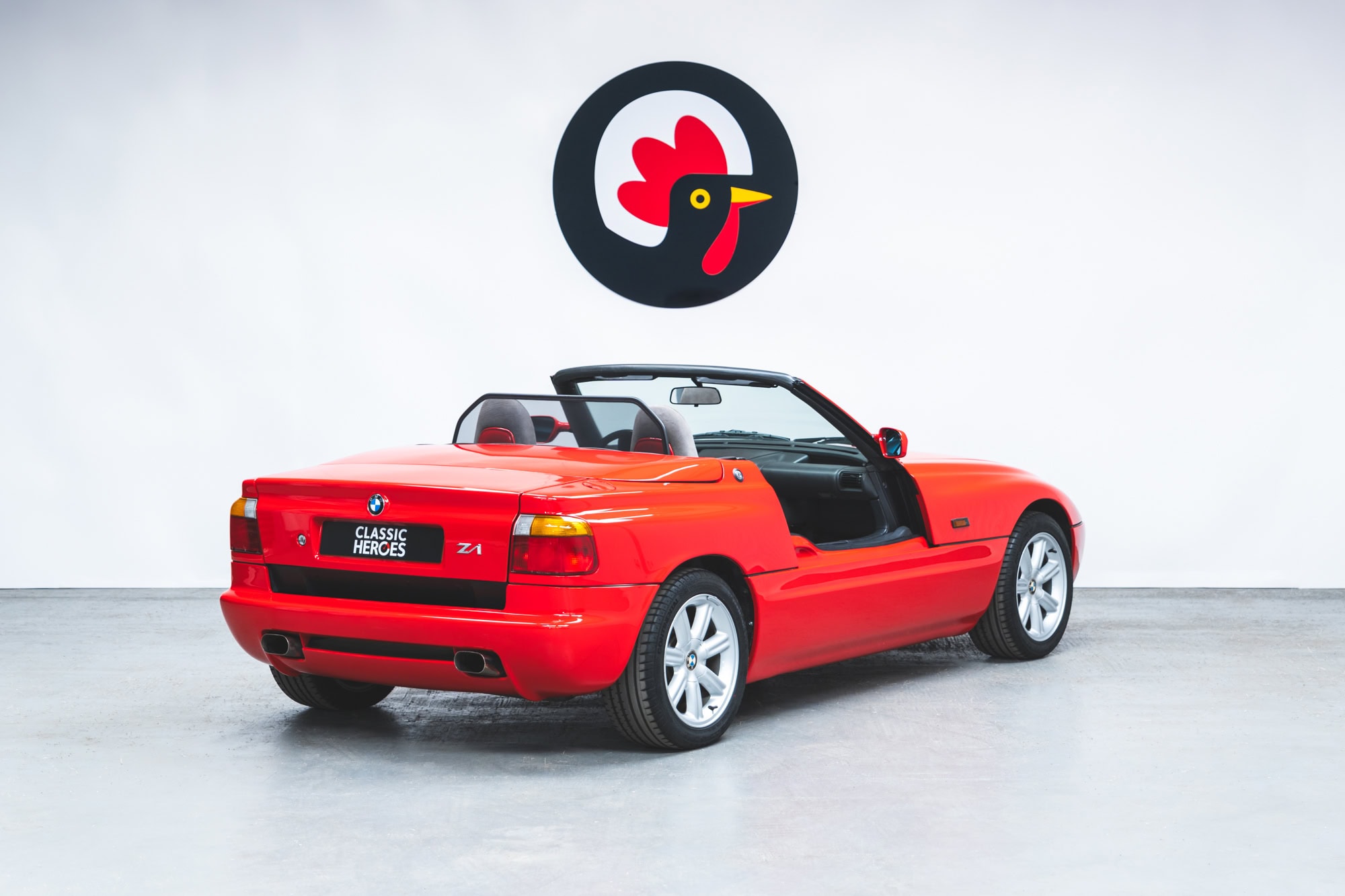 Rear exterior view of Top Red BMW Z1 with roof down.