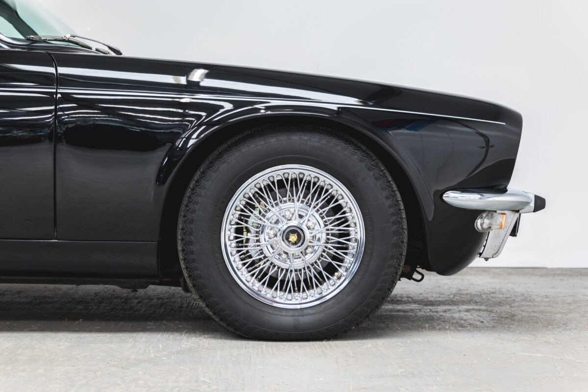 Front quarter of Jaguar XJC V12 Coupe Sports Saloon showing 15 inch wire wheels.