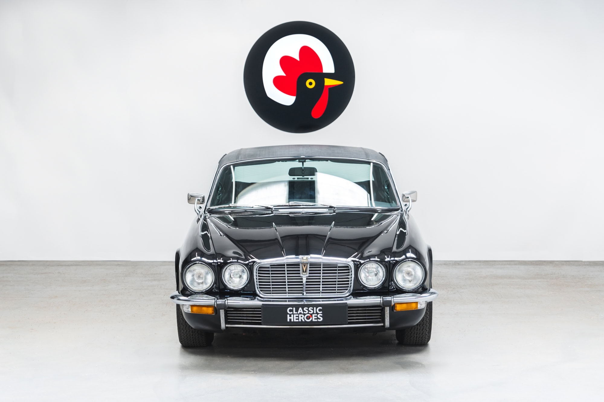 Front exterior view of black gloss Jaguar XJC V12 Coupe Sports Saloon with vinyl roof.