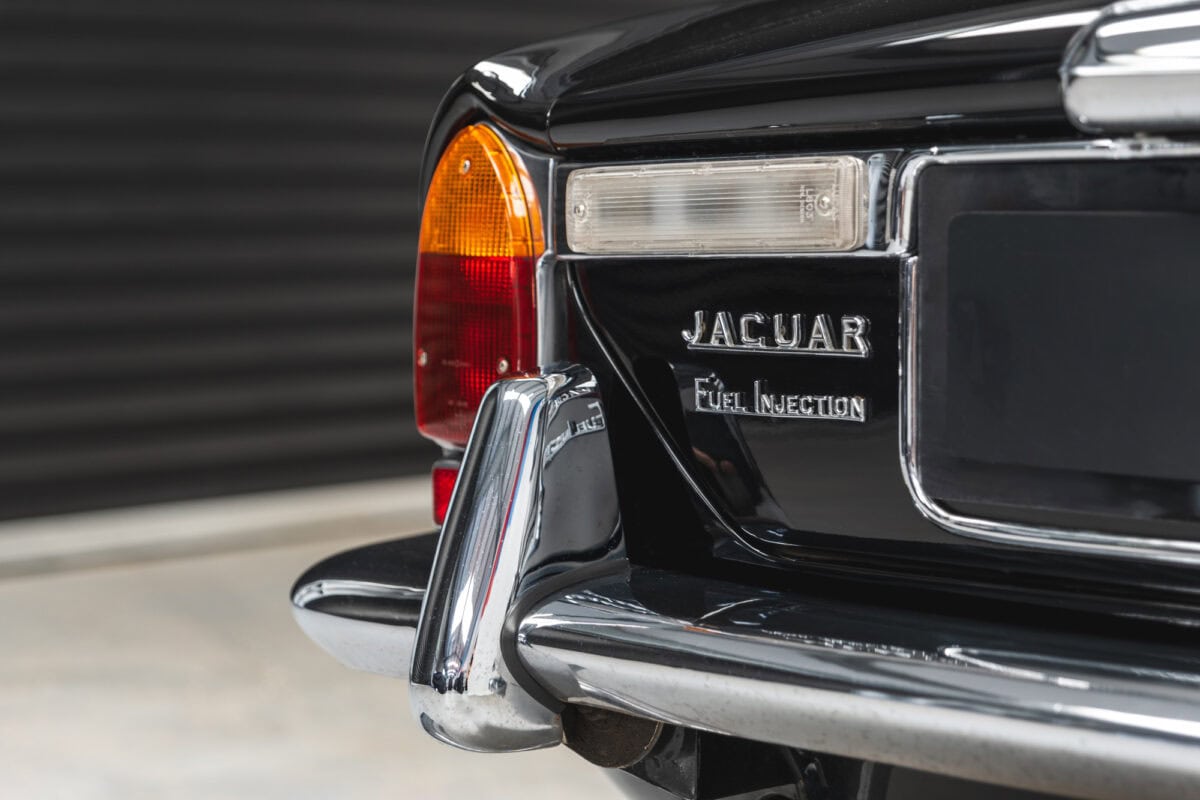 Chrome bumper and indicators on black gloss Jaguar XJC V12 Coupe Sports Saloon.