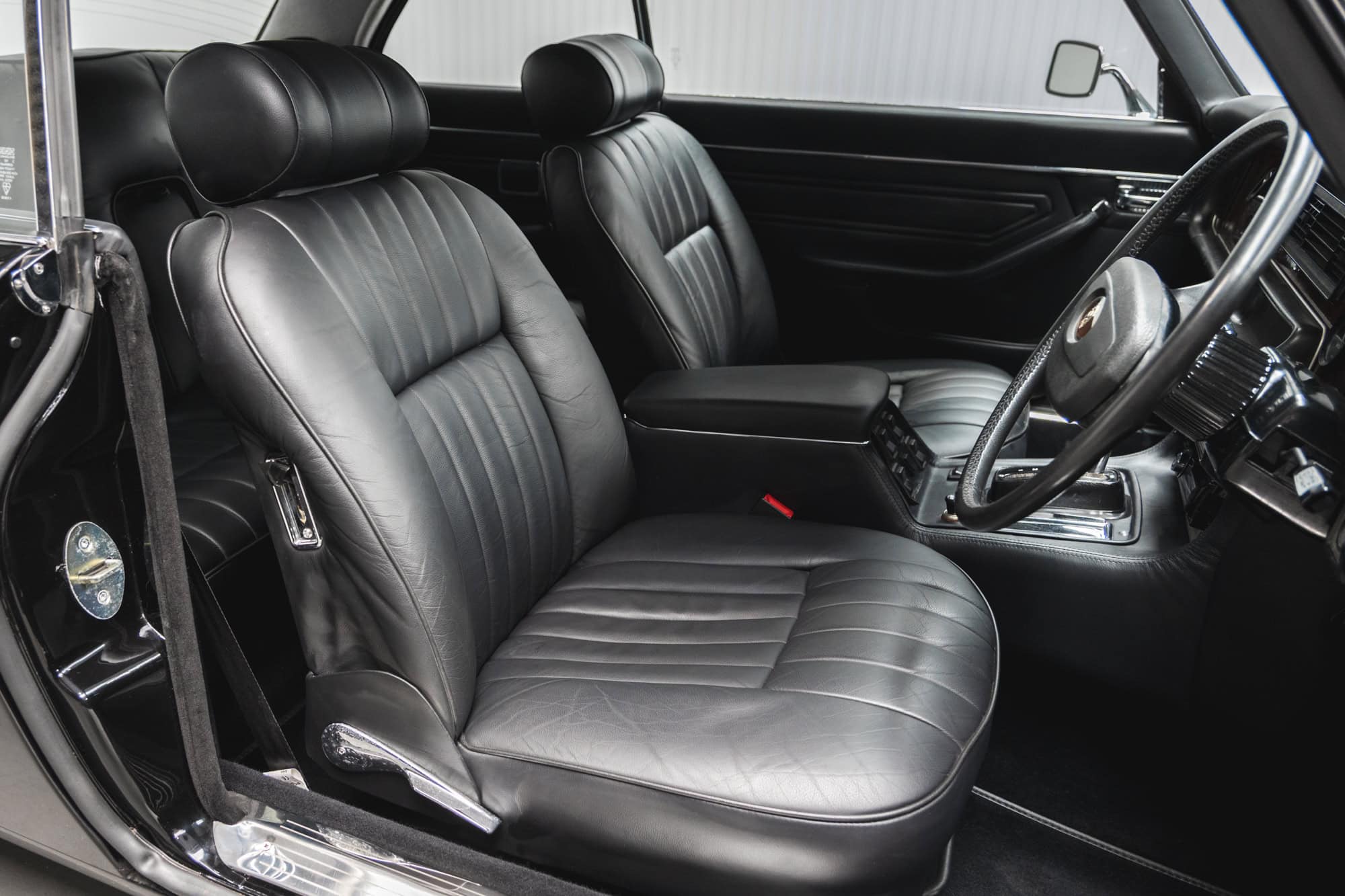 Offside interior view of black nappa leather in Jaguar XJC V12 Coupe Sports Saloon.