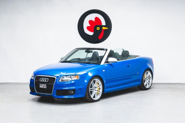 Nearside exterior of Audi RS4 B7 Cabriolet Sprint Blue Supercharged with roof down.