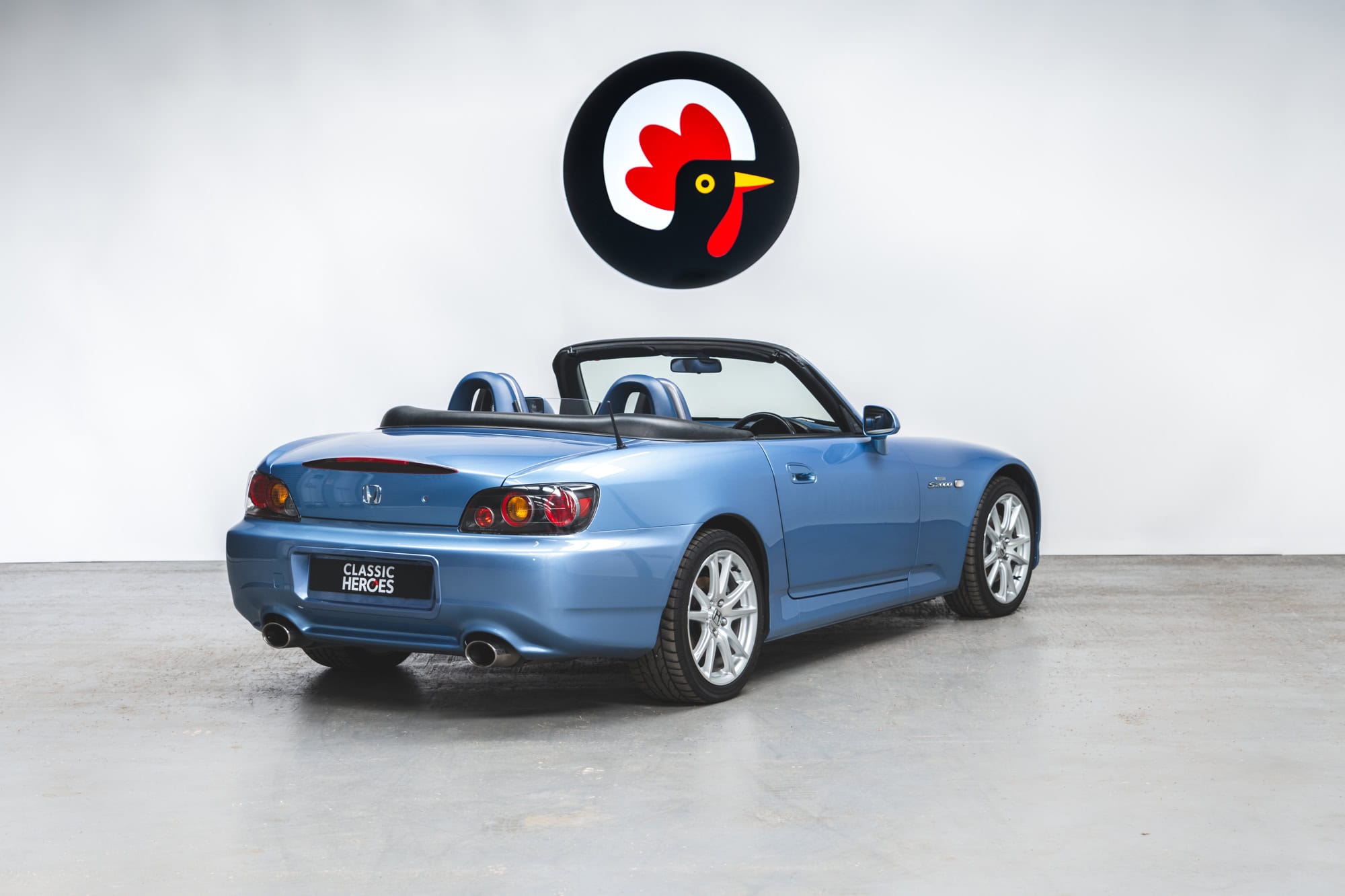 Rear view of Nurburgring Blue Metallic Honda S2000 with 17 inch alloy wheels.