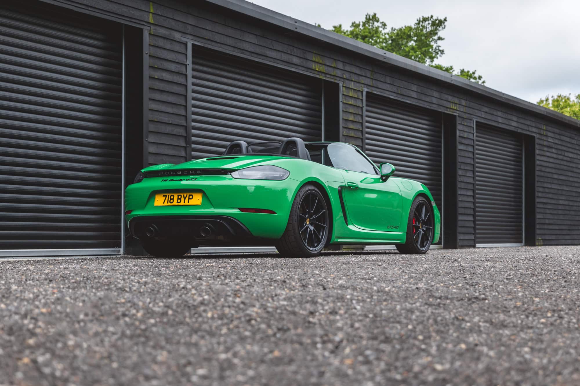 Rear exterior of Porsche Boxster 718 Spyder GTS Python Green.