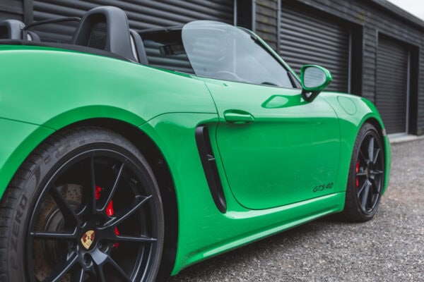 Offside exterior of Porsche Boxster 718 Spyder GTS Python Green.