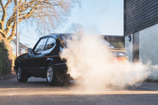 A mk3 Ford Capri 2.9 laser injection model in black on a cold morning at Hero Motor Company.