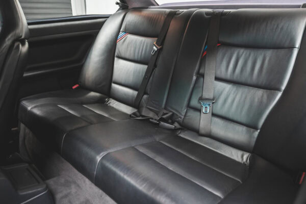 Black leather back seat with BMW M stripes on BMW E36 M3 Avus Blue Metallic.