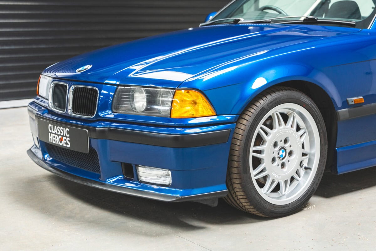 Front nearside quarter showing headlamps on BMW E36 M3 Avus Blue Metallic.