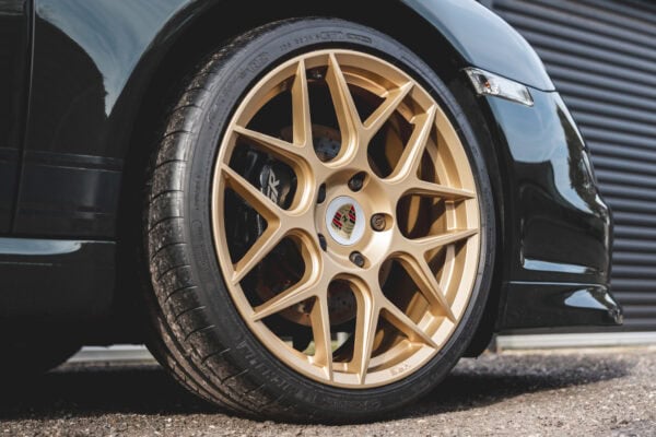 A refurbished HRE forge alloy wheel on a Porsche 997.