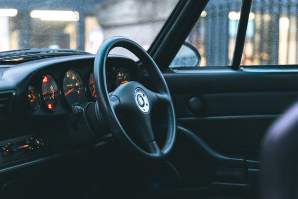 A Porsche 993 interior with retrimmed RS steering wheel.