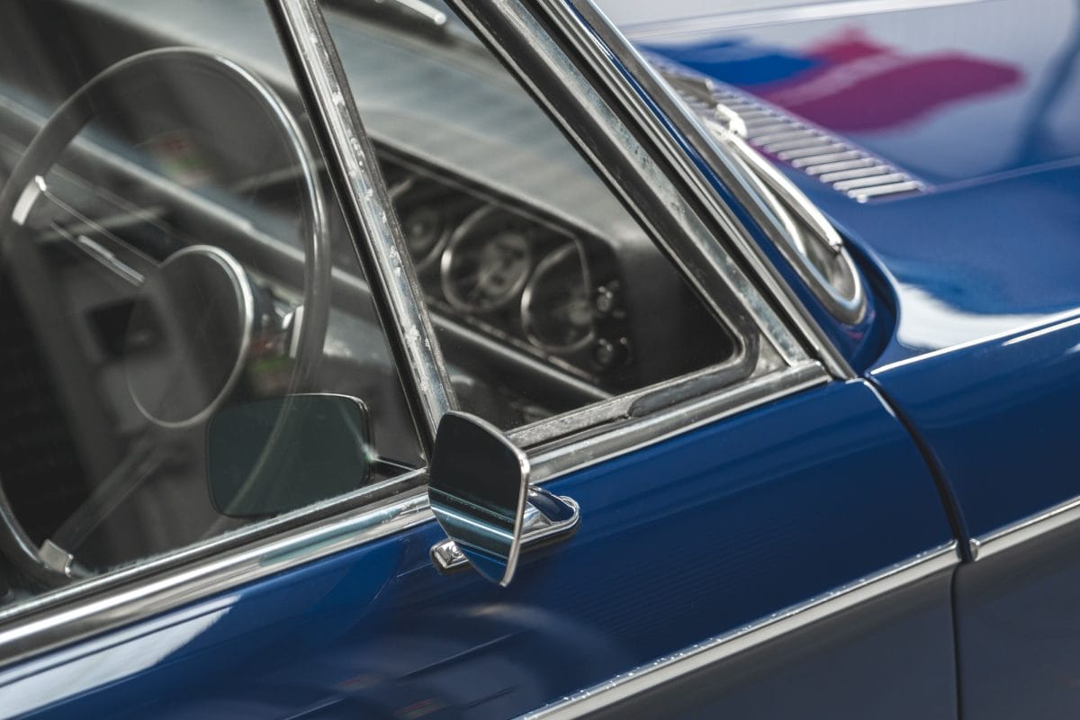 Exterior offside view of wing mirror and centre console on BMW 2002 1968 Pacific Blue.