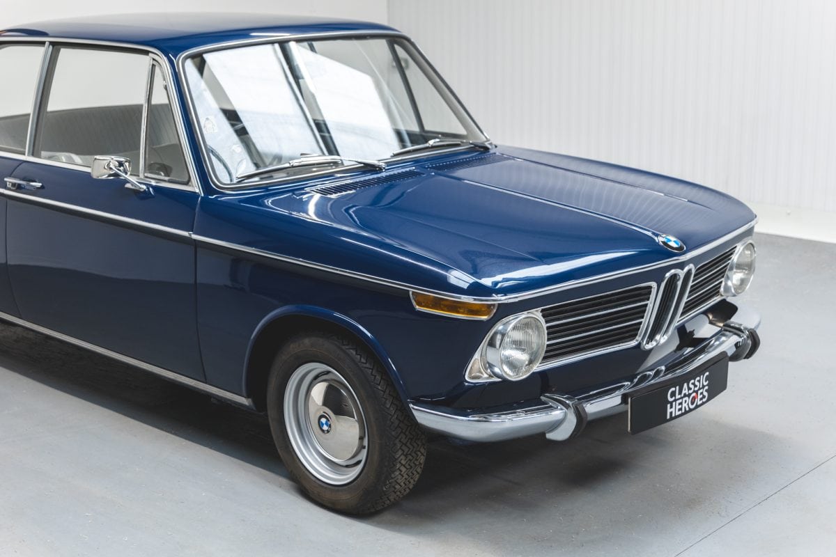 Offside exterior showing chrome front grill and bumper on BMW 2002 1968 Pacific Blue.