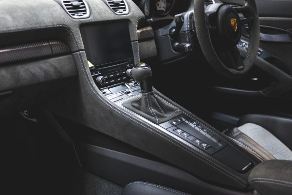 Centre console including steering wheel and gear level on Porsche GT4 RS Oak Green Weissach.