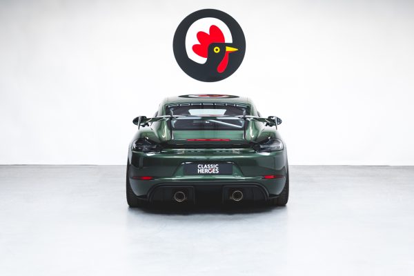 Rear exterior view with exhaust tailpipes on Porsche GT4 RS Oak Green Weissach.