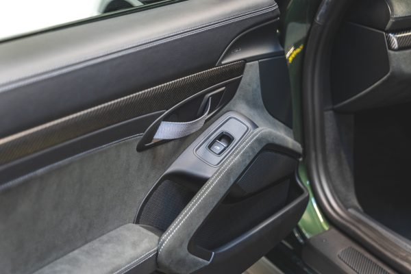 Door opener and door pocket in Porsche GT4 RS Oak Green Weissach.