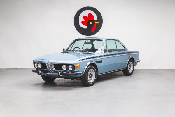 Nearside front exterior of BMW 3.0 E9 CSL Fjord Blue showing alloys headlamps and shark nose.