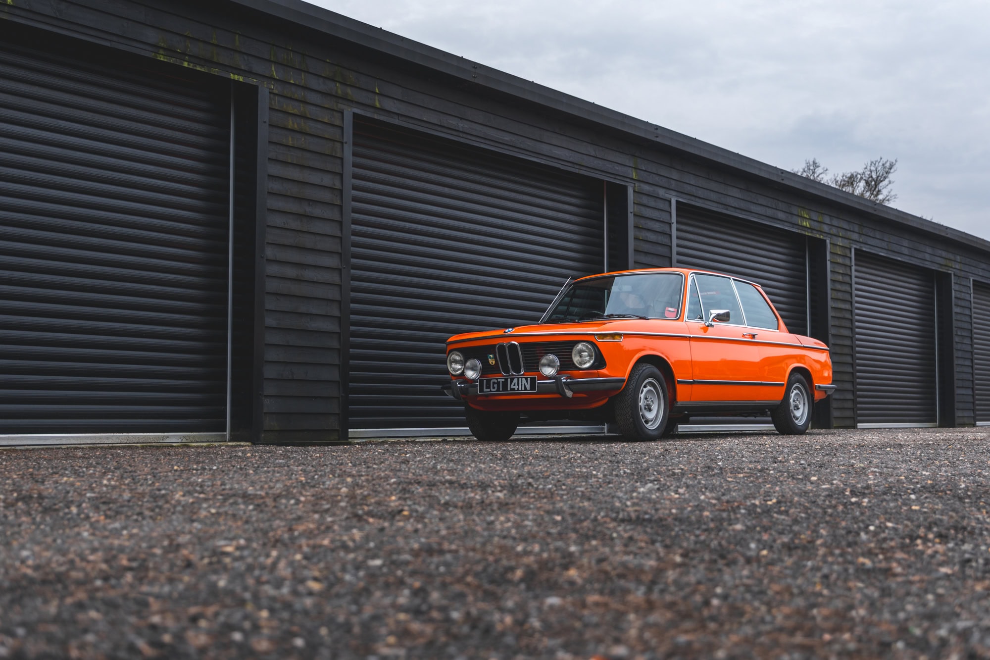 Front nearside exterior showing front grill on BMW 2002 tii Inka Orange.