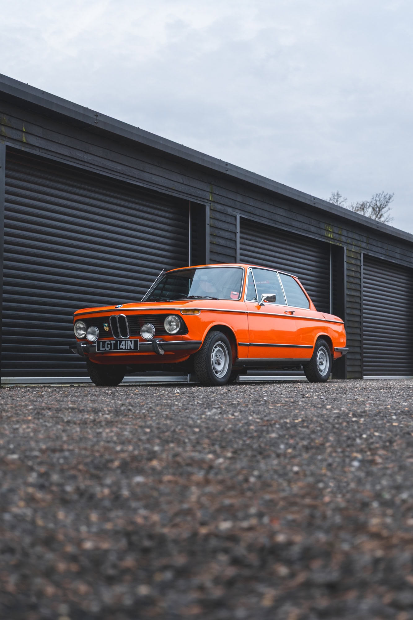 Front nearside exterior showing front grill on BMW 2002 tii Inka Orange.