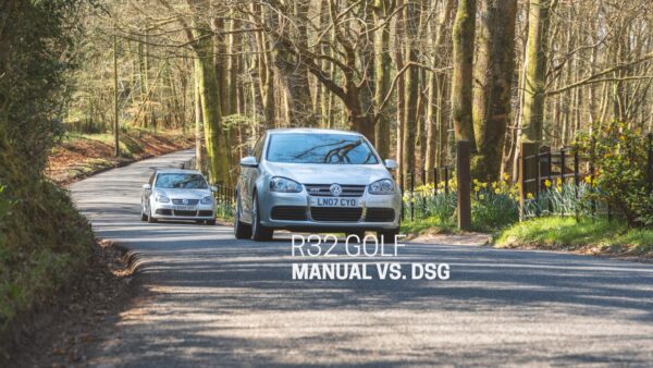 Two silver mk5 Volkswagen Golf r32's chase each other down a country road.