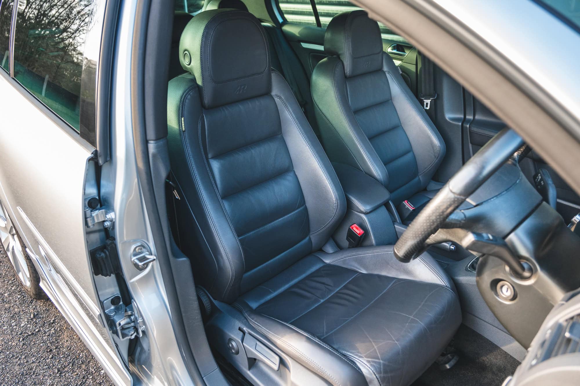 Offside view of black leather interior on Volkswagen Golf R32 Hero Collection showing steering wheel
