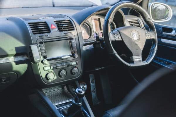 Interior of Volkswagen Golf R32 Hero Collection showing centre console gear lever and steering wheel.
