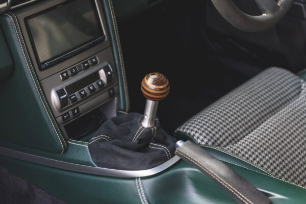 A custom wood gear knob in a Porsche 911.