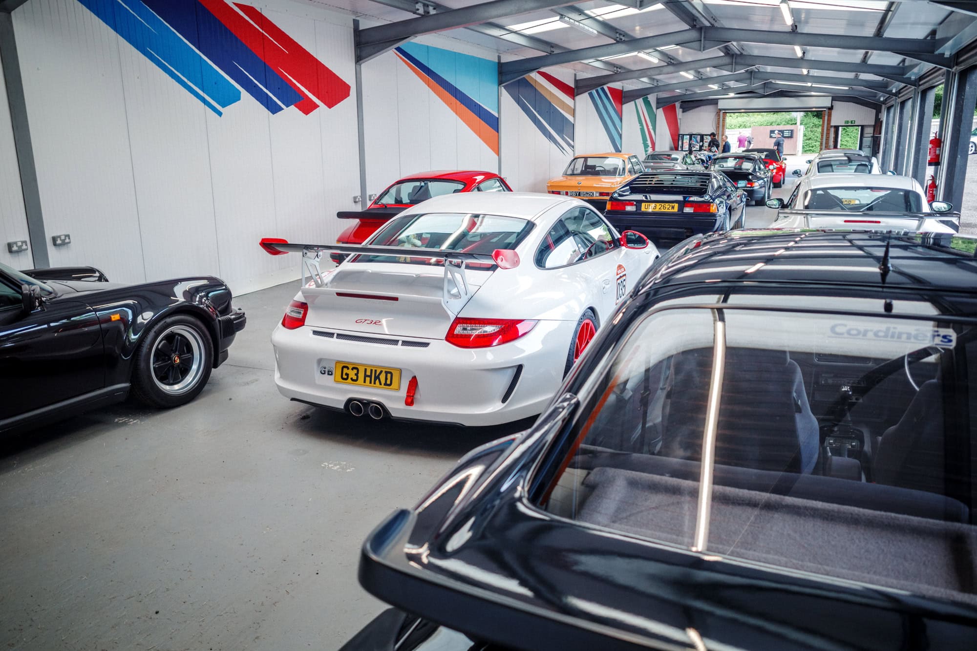 A collection of rare and valuable cars on display.