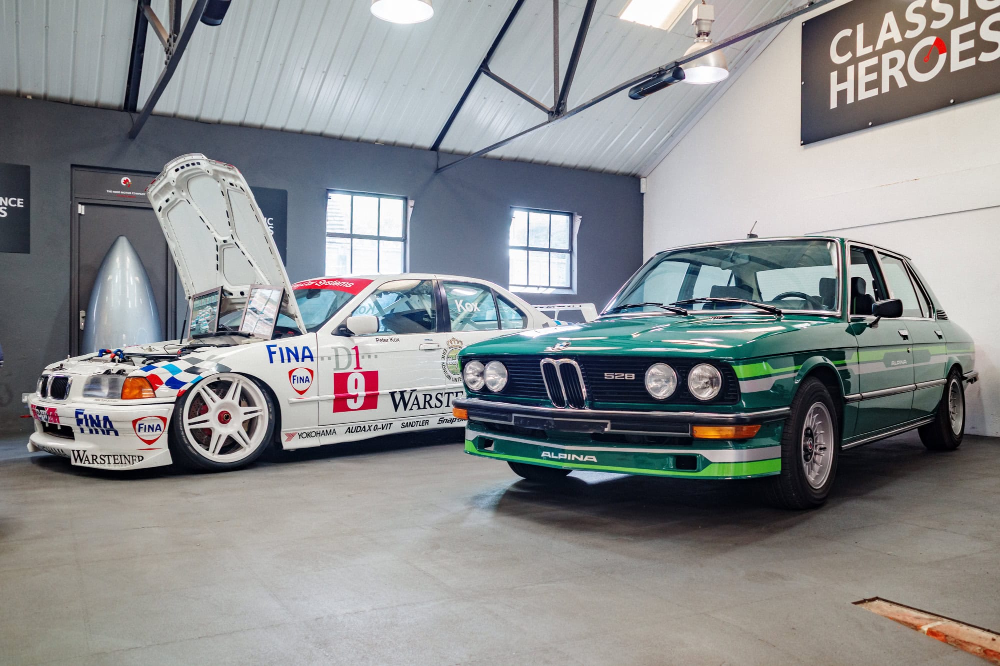 A BMW E36 super tourer BTCC racing car and green Alpina B6.