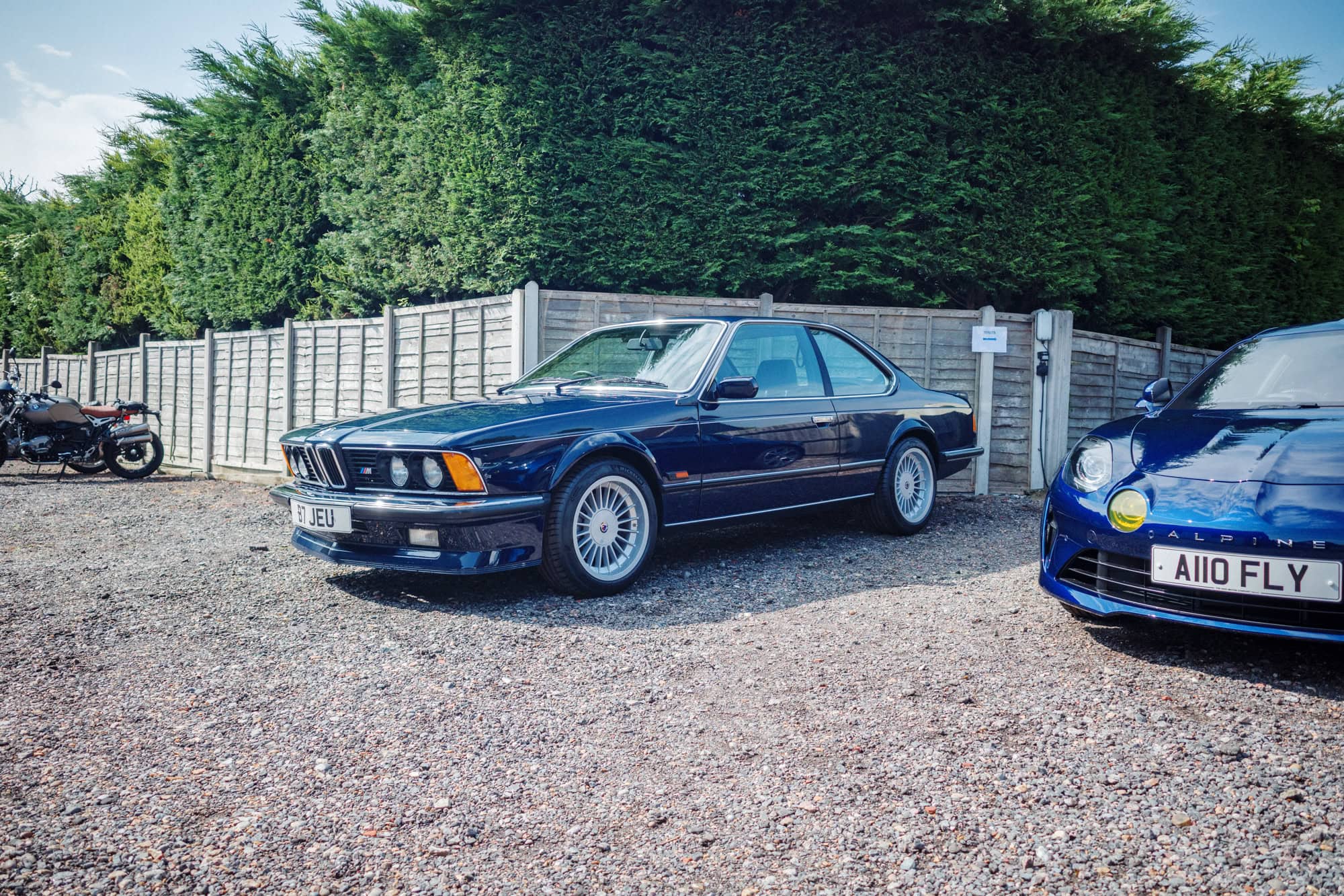 A dark blue BMW E24 M635 on Alpina wheels.